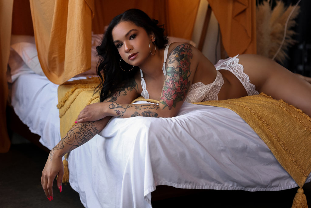 Hampton Roads Boudoir Photography | Tattooed Woman Wearing White Lingerie Set and Hoop Earrings | Virginia Beach Boudoir Photographer | Be A Peach Boudoir